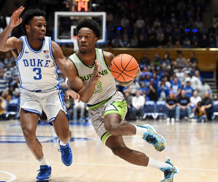 Queens Royals guard Deyton Albury (13) drives to the basket as Duke Blue Devils guard Jeremy Roach (3) defends during the first half at Cameron Indoor Stadium.